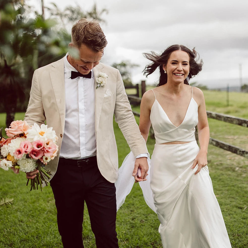 Turn heads at your special day with this exquisite two-piece robe chance dress! Boasting spaghetti straps, a custom made Sheath V Neck and a backless design, this timeless minimalist dress is perfect for any bride looking to make a lasting statement. Crafted from luxurious crepe fabric for ultimate comfort and style, this gorgeous crop top is sure to make your grand entrance memorable!