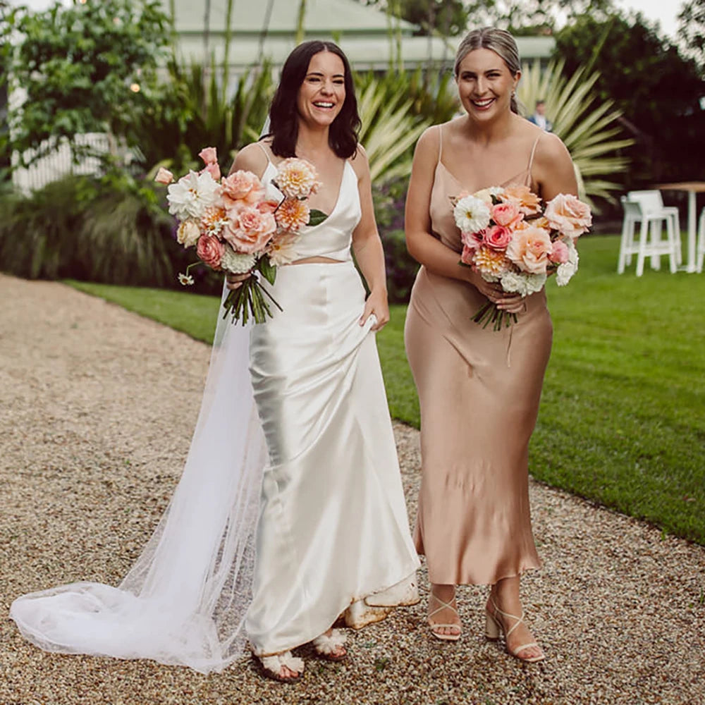 Turn heads at your special day with this exquisite two-piece robe chance dress! Boasting spaghetti straps, a custom made Sheath V Neck and a backless design, this timeless minimalist dress is perfect for any bride looking to make a lasting statement. Crafted from luxurious crepe fabric for ultimate comfort and style, this gorgeous crop top is sure to make your grand entrance memorable!