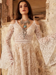 Indulge in the ethereal beauty of our Robe Vivien. This exquisite bridal gown features an empire V-neck, sweep floor length, cut-out open back, and delicate lace detailing. Elegantly crafted for your special day, it exudes grace and sophistication. Feel like a goddess on your wedding day with Robe Vivien.