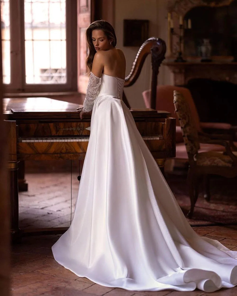 Elevate your bridal look with our Robe Noémie. Crafted with shimmering sequins and delicate beading, this satin dress exudes sophistication. The detachable train offers versatility, while the off the shoulder design adds a touch of romance. Perfect for the modern bride looking for a statement dress.