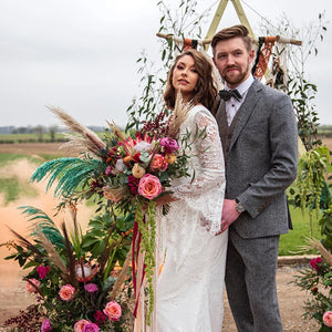 Indulge in the timeless elegance of the Robe Valentia. Its countryside rustic boho lace design exudes sophistication, while the mermaid cut and backless style add a touch of allure. With adjustable bell sleeves and a size perfect for elopements, this bridal gown is the epitome of luxury.