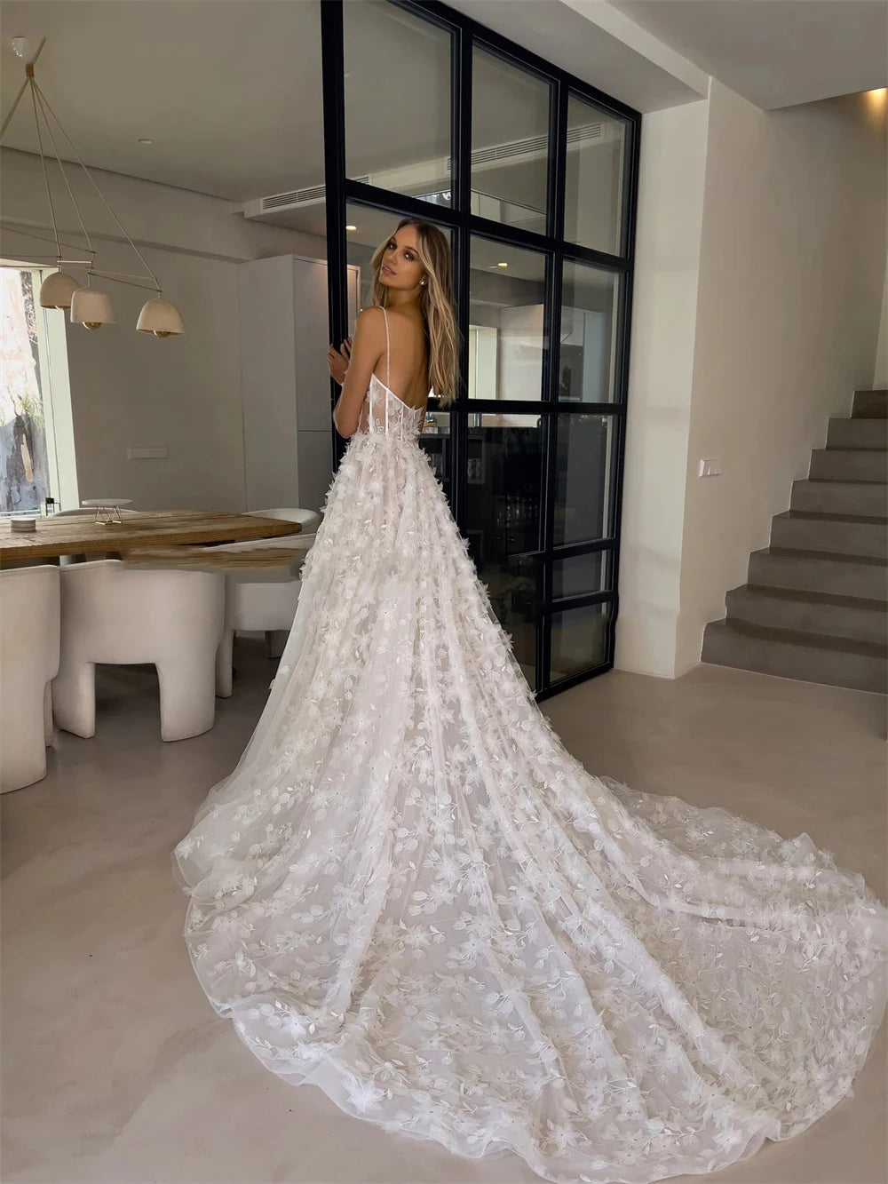 Indulge in pure elegance with Dress Anje. This off-shoulder wedding dress features a mermaid silhouette and a sweeping train, creating a majestic and sophisticated look. The sleeveless design adds a touch of modernity, making it perfect for the fashion-forward bride. Every detail is thoughtfully designed for a truly stunning statement on your special day.