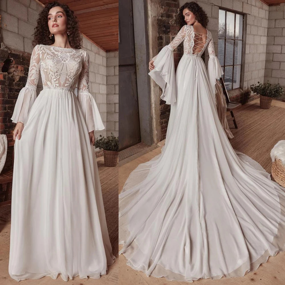 Indulge in luxury with the exquisite Dress Chamilla. This stunning wedding dress features an empire silhouette, elevated by a boat neckline and intricate lace detailing. The flowing chiffon fabric adds a touch of romance, making it the perfect choice for bridal gowns. Walk down the aisle in style and grace.