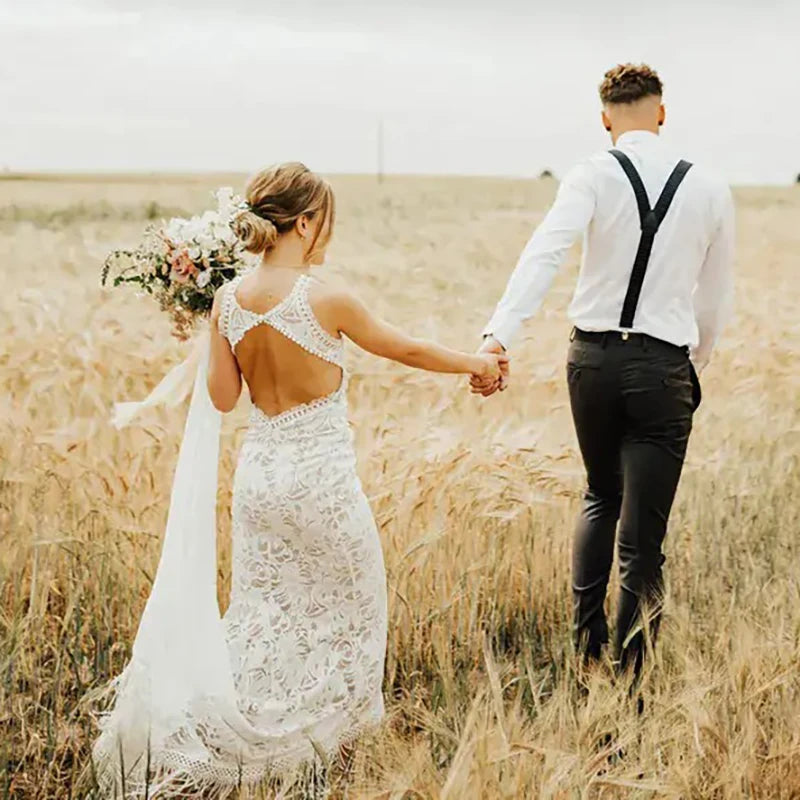 Unleash your inner bride in our Robe Tali - the perfect combination of elegance and rustic charm. Featuring a fringed sheath lace design, this custom-made wedding dress is sure to turn heads. The deep v-neck and halter style add a touch of romance, while the fitted silhouette flatters all sizes. Say "I do" in style with our Robe Tali.