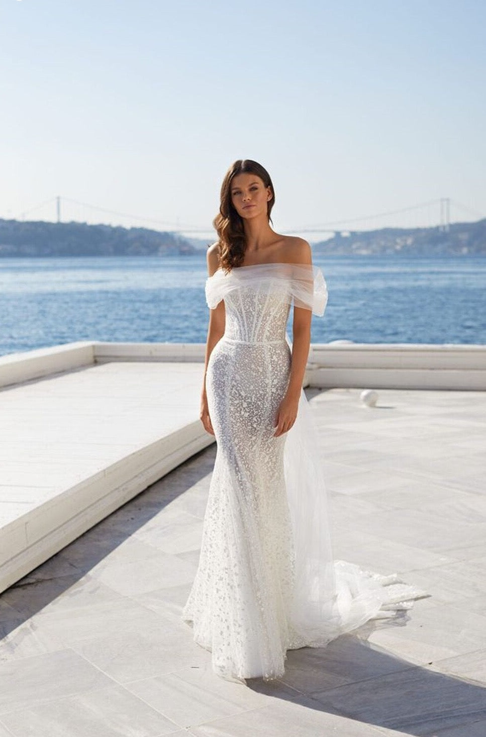 Look like a queen in our stunning Jessie Robe! Illuminating the room with its mermaid lace and off-the-shoulder silhouette, this bridal gown will make you feel like you're ready to rule the night. So, don your crown and get ready for the royal treatment you deserve!