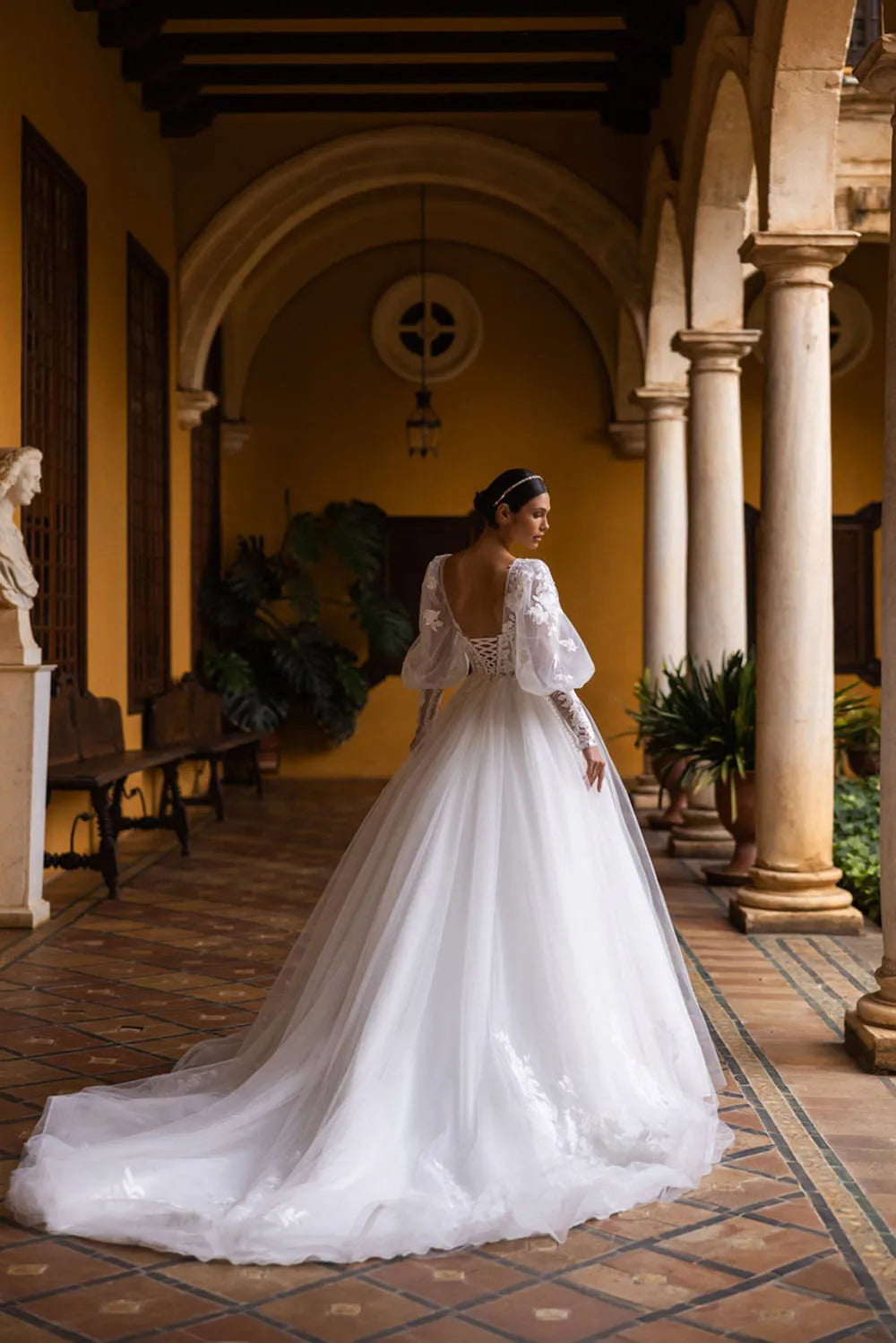 Exude elegance and sophistication in our Robe Indre. This puffy, lace-up princess bridal dress is adorned with delicate lace appliques, making it the perfect choice for a luxurious wedding. Feel like a beautiful princess on your special day with this exclusive gown.