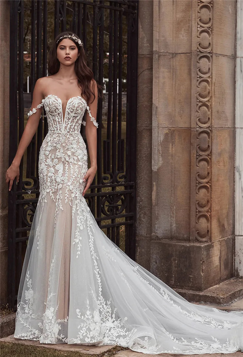 Adorn yourself in luxury with the Robe Olivette, a stunning lace wedding dress fit for a mermaid princess. This dress boasts intricate lace detailing and a form-fitting silhouette to enhance your natural beauty on your special day. Elevate your wedding look with the sophisticated elegance of the Robe Olivette.
