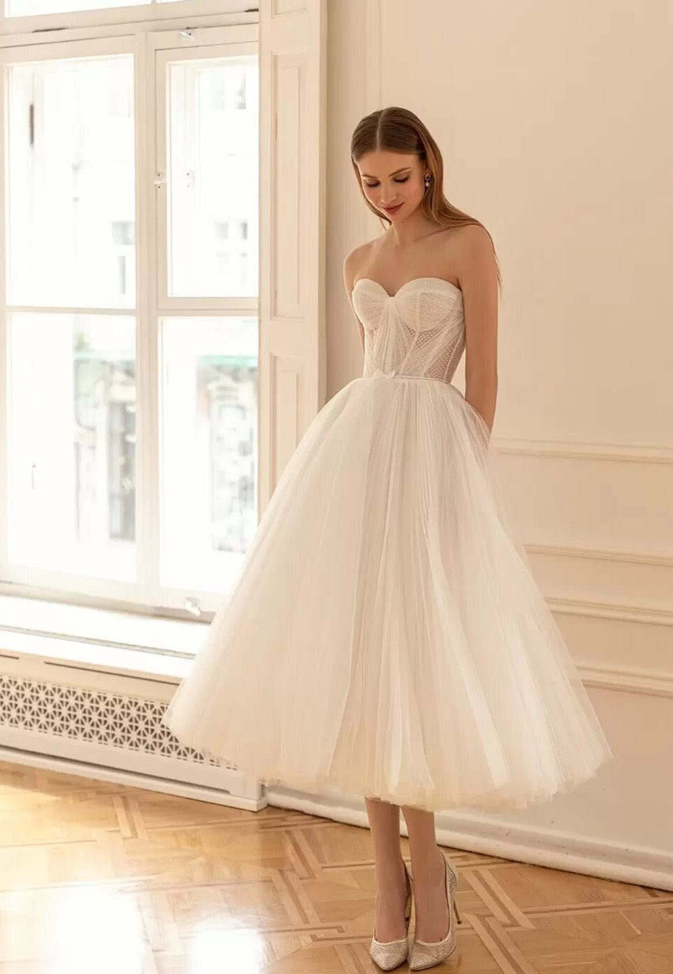 Our Dress Celine combines a sweetheart neckline and A-line silhouette for a flattering and classic bridal look. The two-piece design adds a modern twist, providing versatility for different wedding styles. Perfect for brides who want a timeless yet unique wedding dress.
