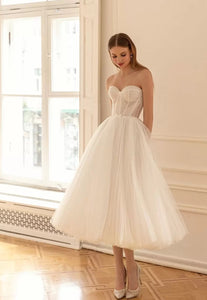 Our Dress Celine combines a sweetheart neckline and A-line silhouette for a flattering and classic bridal look. The two-piece design adds a modern twist, providing versatility for different wedding styles. Perfect for brides who want a timeless yet unique wedding dress.