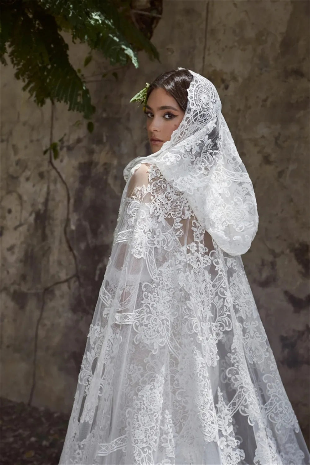 Experience true luxury with the Sabine Robe. This eye-catching floor-length gown features a beautiful mermaid silhouette with a sexy bateau neckline, a daring cut-out open back, and glimmering lace appliqués. Slay the aisle in this statement-making ensemble fit for royalty!