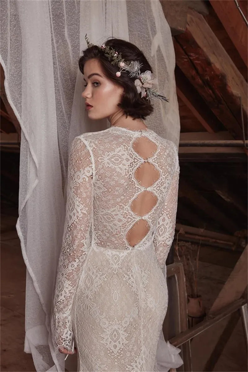 The Aveline wedding dress is perfect for looking beautiful and confident on your special day. The sexy mermaid cut and deep V neckline give you an elegant silhouette while the lace detail and long sleeves add a romantic touch. Create your dream bridal look with this stunning gown.