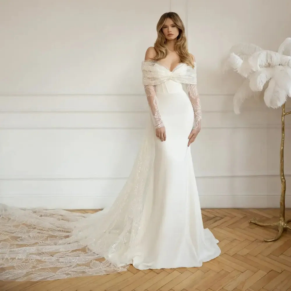 Put a sparkle in your special day with the gorgeous Robe Denisse! Featuring a sweetheart neckline with full long sleeves, this unique sheath bridal gown is sure to turn heads. Wearing it won't just make you look beautiful - you'll feel beautiful too! Make your wedding day unforgettable with Robe Denisse!