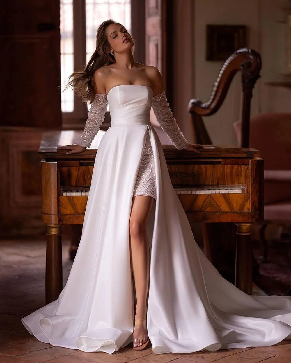 Elevate your bridal look with our Robe Noémie. Crafted with shimmering sequins and delicate beading, this satin dress exudes sophistication. The detachable train offers versatility, while the off the shoulder design adds a touch of romance. Perfect for the modern bride looking for a statement dress.