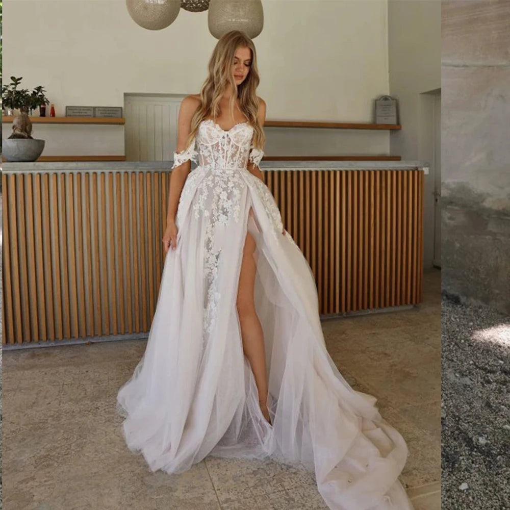 Be the picture of elegance in our Dress Isabella. This beautiful mermaid style wedding dress features an off-shoulder design, sleeveless top, and a high split for a sexy touch. With a sweetheart neckline and backless detail, you'll stun from every angle. Make a statement on your special day with this elegant bridal gown.