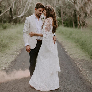 Unleash your inner bride in our Robe Tali - the perfect combination of elegance and rustic charm. Featuring a fringed sheath lace design, this custom-made wedding dress is sure to turn heads. The deep v-neck and halter style add a touch of romance, while the fitted silhouette flatters all sizes. Say "I do" in style with our Robe Tali.