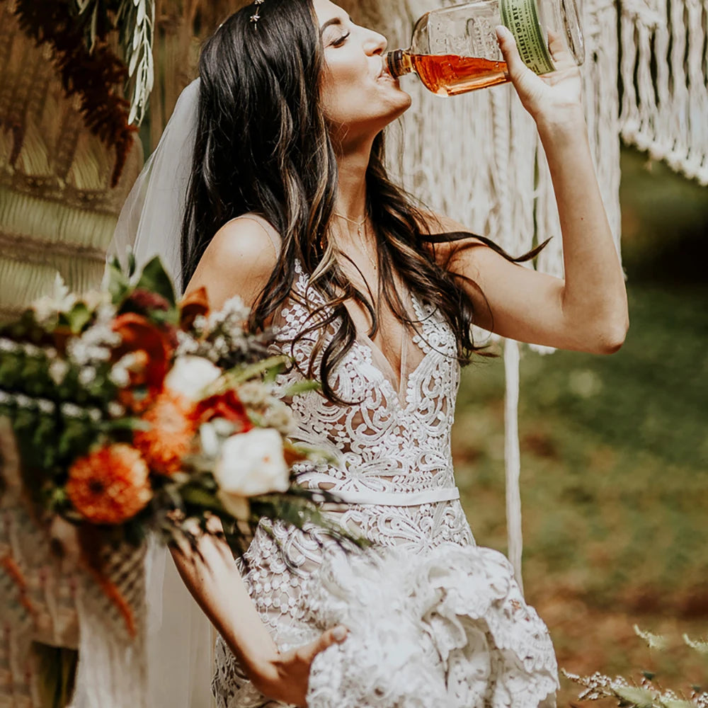 Effortlessly elegant, our Robe Nalini wedding dress features a boho-inspired cutout lace design with a flattering mermaid silhouette. Designed to be customized for plus-size brides, this dress also boasts a stunning hollow open back and long sleeves, creating a truly romantic and unique look for your special day.