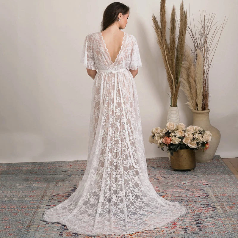 Feel like a boho princess in the Dress Vanille! Perfect for beach weddings, this dress features a V-neck, flutter sleeves, and a sheer back with delicate lace details. The high split adds a touch of elegance to this whimsical and playful design. Say 'I do' in style!
