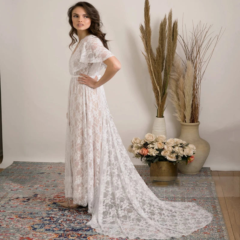 Feel like a boho princess in the Dress Vanille! Perfect for beach weddings, this dress features a V-neck, flutter sleeves, and a sheer back with delicate lace details. The high split adds a touch of elegance to this whimsical and playful design. Say 'I do' in style!