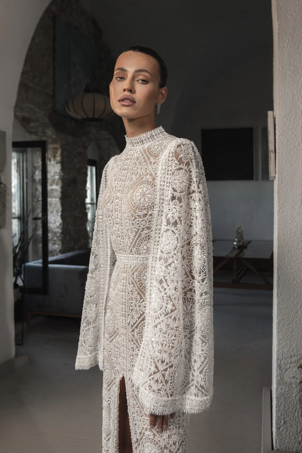 Make a statement on your special day with the Milana Dress. This stunning bridal gown boasts elegant embroidery for a touch of romance and sophistication. Step into your wedding with grace and style in this one-of-a-kind dress.