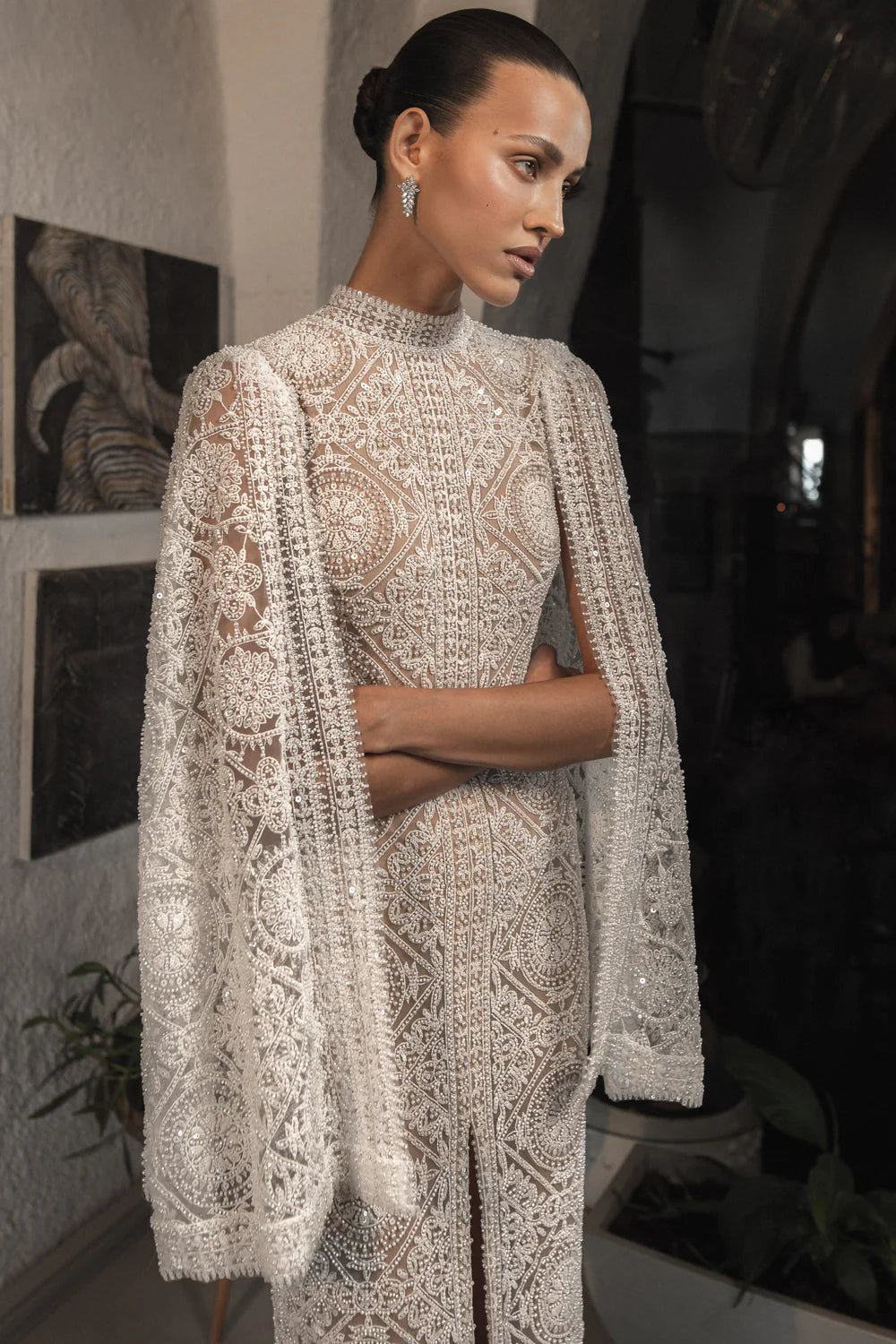 Make a statement on your special day with the Milana Dress. This stunning bridal gown boasts elegant embroidery for a touch of romance and sophistication. Step into your wedding with grace and style in this one-of-a-kind dress.