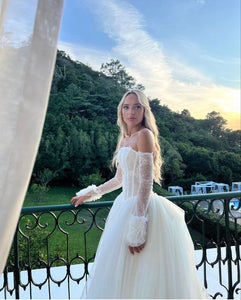 Elevate your special day with the captivating Robe Hannah. This elegant bridal gown exudes sophistication and grace, making you feel stunning as you walk down the aisle. Let its timeless design and flawless fit enhance your beauty and create timeless memories.