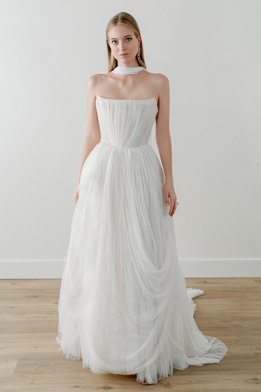 Introducing the Bridget Corset Gown, a modern twist on the timeless ballgown silhouette. With its soft net tie and Georgian-style corsetry, this gown exudes romance and structure. Delicate tucks add an element of intrigue, creating a unique and elegant creation that embodies contemporary style. Crafted from soft netting, the Bridget Corset Gown is a perfect blend of modern and classic design.