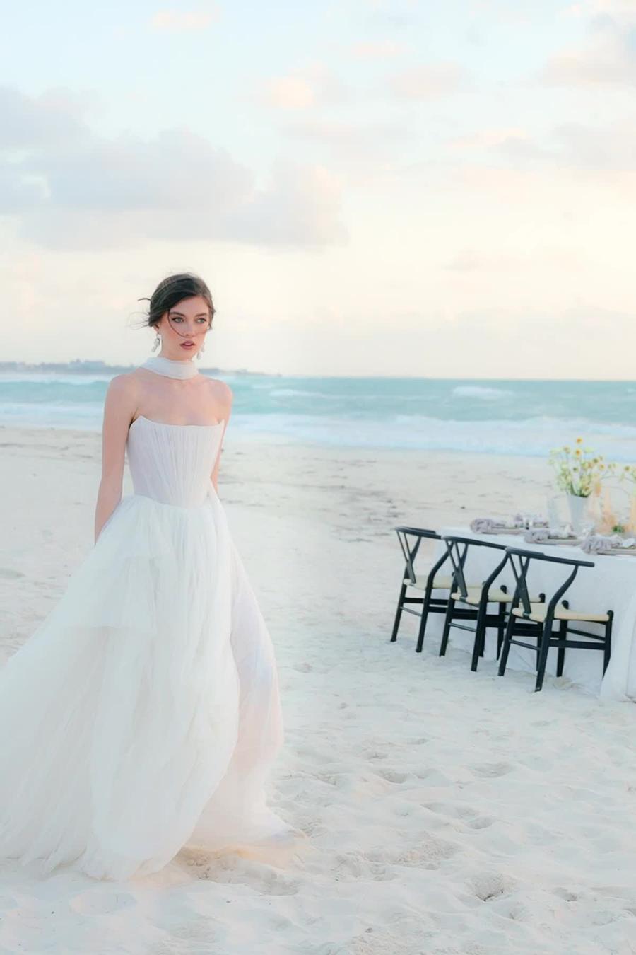 Introducing the Bridget Corset Gown, a modern twist on the timeless ballgown silhouette. With its soft net tie and Georgian-style corsetry, this gown exudes romance and structure. Delicate tucks add an element of intrigue, creating a unique and elegant creation that embodies contemporary style. Crafted from soft netting, the Bridget Corset Gown is a perfect blend of modern and classic design.