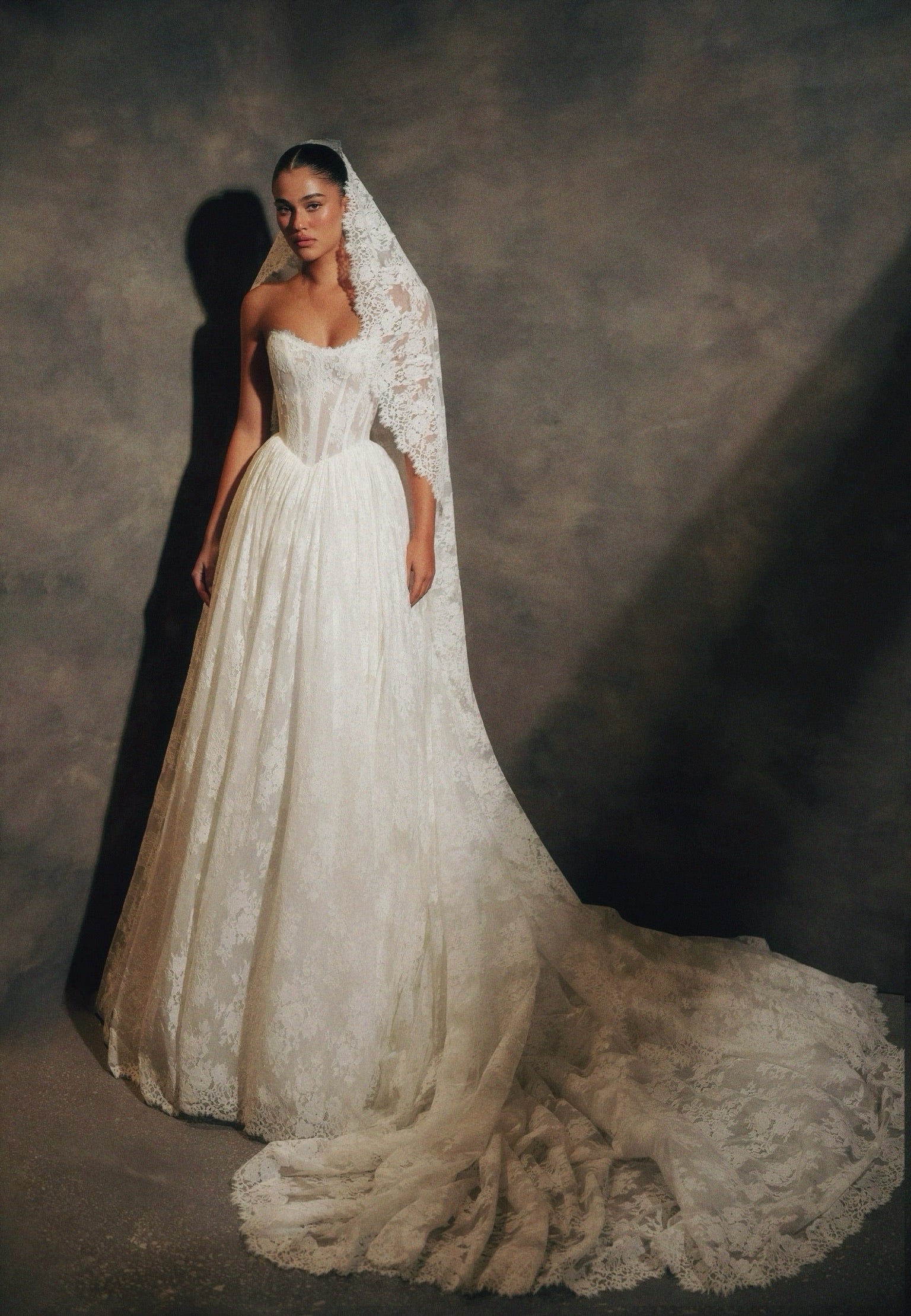Feel like a true icon in the Venus Gown. This luxurious gown features pearlescent beading, long sheer sleeves, and a detachable cowl. The stunning detachable belt elevates the modern design, making you feel glamorous and sophisticated. Perfect for any special occasion.