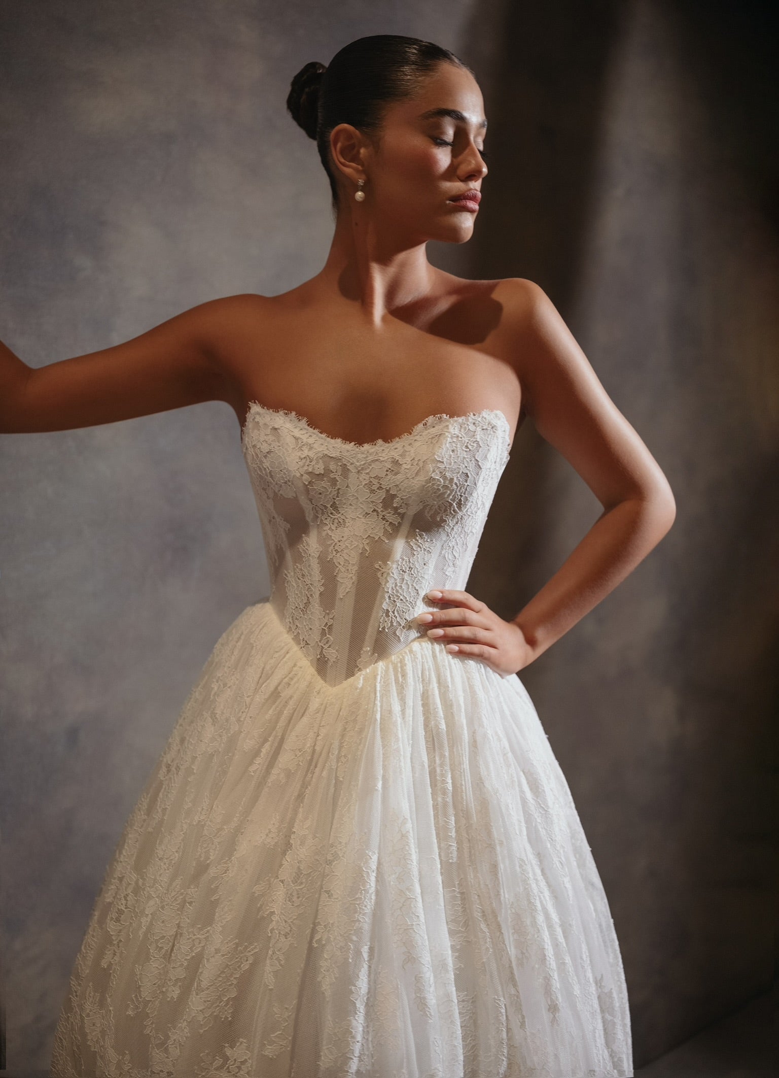 Feel like a true icon in the Venus Gown. This luxurious gown features pearlescent beading, long sheer sleeves, and a detachable cowl. The stunning detachable belt elevates the modern design, making you feel glamorous and sophisticated. Perfect for any special occasion.