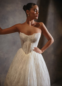 Feel like a true icon in the Venus Gown. This luxurious gown features pearlescent beading, long sheer sleeves, and a detachable cowl. The stunning detachable belt elevates the modern design, making you feel glamorous and sophisticated. Perfect for any special occasion.