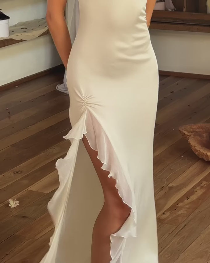The Silk Blend Ivory Maxi Dress combines refined elegance with everyday comfort. Crafted from medium-weight jersey fabric, it molds gracefully to your form while allowing unrestricted movement. The adjustable tie-back closure lets you customize the fit, while delicate ruffled edges add flowing dimension. A detachable scarf accent provides styling versatility for any occasion. Unlined construction ensures breathability and ease, making this piece perfect for weddings, celebrations, or whenever you want to lo