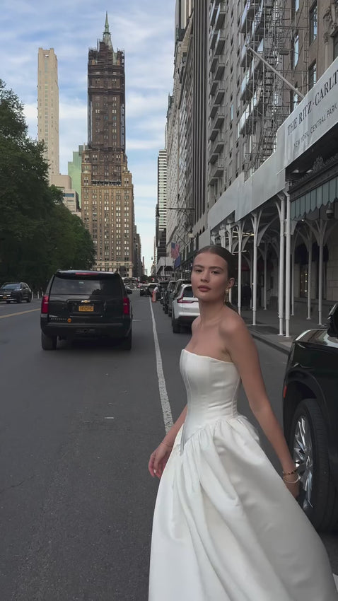 Upgrade your style with the versatile and feminine Maddison Dress. From the ceremony to the after-party, this strapless design effortlessly adapts to your desired look. Elevate your wedding attire with the perfect choice: the Eva Dress, your go-to for both beauty and functionality.